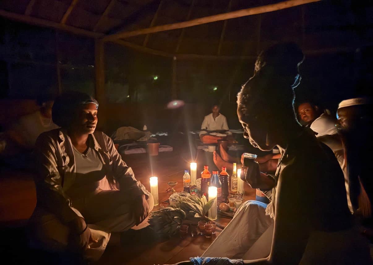 nighttime ceremony with aya and candles